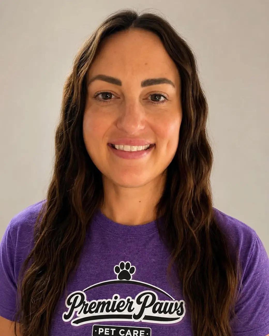 Kylie smiling in a purple Premier Paws t-shirt